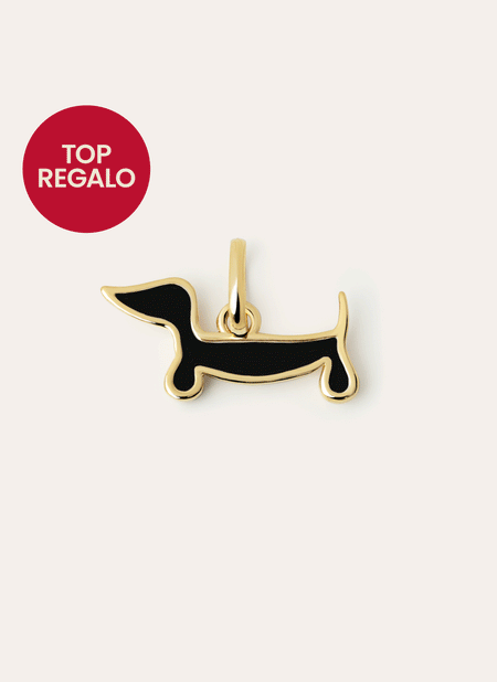 Charm de un perro salchita reversible, por un lado es de color oro y por el otro negro
